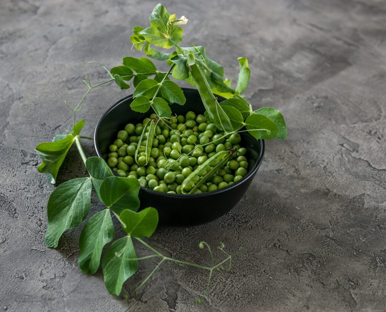 Rustic bowl with green peas, naturally grown